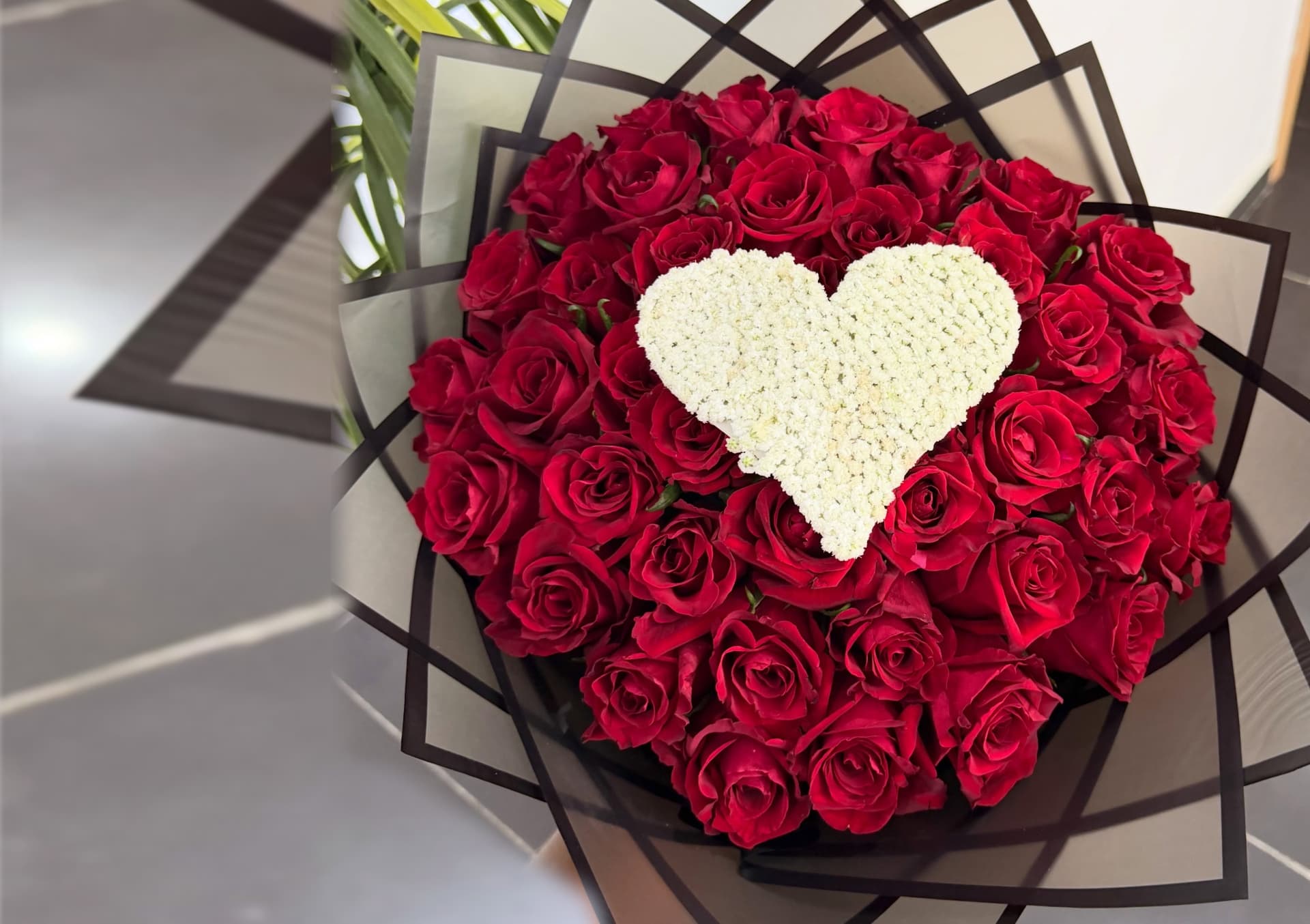 Grand luxury bouquet of fresh red roses with a scroll message from @flowersandflowersng